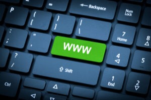 Close up laptop keyboard focus www key toning is blue